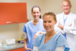 Portrait of smiling medical professional team at the surgery office