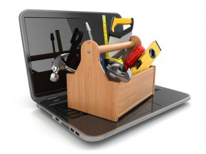 Online support. Laptop and toolbox on white isolated background. 3d